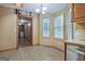 View of a kitchen nook with tile floors, a sign that says 'KITCHEN', and lots of bright windows at 351 Weldon Rd, Palmetto, GA 30268