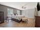 Spacious main bedroom with wood flooring, ceiling fan, and large windows for ample natural light at 351 Weldon Rd, Palmetto, GA 30268