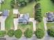 Expansive property featuring a well-maintained lawn, mature trees, and multiple outbuildings, offering privacy and space at 106 Big Cotton Trl, Mcdonough, GA 30252