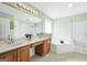 Spacious bathroom features double sink vanities, a soaking tub, and a separate glass shower at 106 Big Cotton Trl, Mcdonough, GA 30252