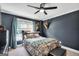 Charming bedroom with a decorative wall and a well-lit window at 106 Big Cotton Trl, Mcdonough, GA 30252