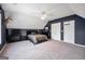 Large bedroom with ample space and a unique half wall paint job at 106 Big Cotton Trl, Mcdonough, GA 30252