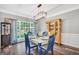 Well-lit dining area with a charming hutch and natural light, perfect for Gathering meals at 106 Big Cotton Trl, Mcdonough, GA 30252