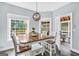 Bright dining room with natural light, modern lighting, and deck access at 106 Big Cotton Trl, Mcdonough, GA 30252