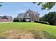 Charming two-story home featuring a well-manicured front lawn and traditional architectural details at 106 Big Cotton Trl, Mcdonough, GA 30252