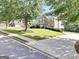 Charming two-story home with brick exterior, landscaped yard, and long driveway at 106 Big Cotton Trl, Mcdonough, GA 30252