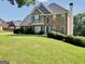 Charming two-story brick home with manicured lawn and inviting curb appeal at 106 Big Cotton Trl, Mcdonough, GA 30252