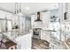 Modern kitchen with white cabinets, granite countertops, and stainless steel appliances at 106 Big Cotton Trl, Mcdonough, GA 30252