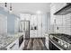 Updated kitchen with stainless steel appliances, white cabinetry and granite counters at 106 Big Cotton Trl, Mcdonough, GA 30252