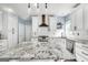 Newly remodeled kitchen features stainless appliances, an island and modern backsplash at 106 Big Cotton Trl, Mcdonough, GA 30252