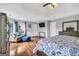 Spacious main bedroom has a tray ceiling, hardwood floors, with sofa and large windows at 106 Big Cotton Trl, Mcdonough, GA 30252