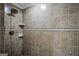 Bathroom features a shower with neutral ceramic tiles and built-in shelving at 106 Big Cotton Trl, Mcdonough, GA 30252