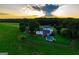 Aerial view of beautiful estate home with pool, screened porch, and lush landscaping at 1074 Glenloch Rd, Roopville, GA 30170