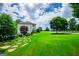 Expansive backyard featuring lush green lawn and a fenced-in area at 1074 Glenloch Rd, Roopville, GA 30170