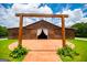 The barn has an open entry and a concrete walkway leading to the front doors at 1074 Glenloch Rd, Roopville, GA 30170