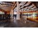 Spacious barn interior with concrete floors and tables and chairs setup for event at 1074 Glenloch Rd, Roopville, GA 30170