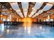 Open barn venue space with draped ceiling, concrete floors, and tables ready for event at 1074 Glenloch Rd, Roopville, GA 30170
