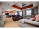 Finished basement featuring a multiple seating areas, an exercise area, and neutral colors at 1074 Glenloch Rd, Roopville, GA 30170