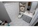 Bathroom with a gray vanity, white floral shower curtain, and tile flooring at 1074 Glenloch Rd, Roopville, GA 30170