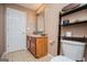 Bathroom featuring a wooden vanity, tile floor, and modern fixtures at 1074 Glenloch Rd, Roopville, GA 30170