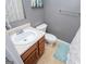 Bathroom featuring a vanity with sink, toilet, and shower with decorative curtain at 1074 Glenloch Rd, Roopville, GA 30170