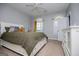 Comfortable bedroom with neutral paint, arched windows, and a white bed set at 1074 Glenloch Rd, Roopville, GA 30170