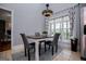 Breakfast area with a chandelier and view of the deck at 1074 Glenloch Rd, Roopville, GA 30170