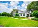 Sprawling two-story home with a manicured lawn and side-entry garage at 1074 Glenloch Rd, Roopville, GA 30170