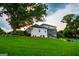 Exterior of a beautiful two-story white brick home with an inground pool and green lawn at 1074 Glenloch Rd, Roopville, GA 30170