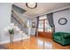 Elegant foyer with hardwood floors, a staircase, and an oversized glass door at 1074 Glenloch Rd, Roopville, GA 30170
