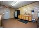 This commercial kitchen is designed with ample counter space and storage cabinets, with refrigerator and door to exterior at 1074 Glenloch Rd, Roopville, GA 30170