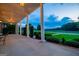 Inviting covered porch with stately columns overlooking lush green fields and mature landscaping at 1074 Glenloch Rd, Roopville, GA 30170