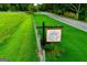 Venue 1074 at Clark & Melon Farms sign next to lush green grassy area near a country road at 1074 Glenloch Rd, Roopville, GA 30170