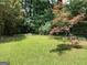 Green backyard with a well-maintained lawn and mature trees, providing a peaceful setting at 3746 Gladney Dr, Atlanta, GA 30341
