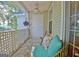 Enjoy the outdoors on this covered balcony featuring comfortable wicker seating and a ceiling fan at 504 Ridgelake Dr, Peachtree City, GA 30269