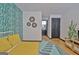 Bright bedroom showcasing a striking accent wall and an ensuite bathroom at 504 Ridgelake Dr, Peachtree City, GA 30269