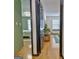 View from hall to bedroom with hardwood floors and natural light at 504 Ridgelake Dr, Peachtree City, GA 30269