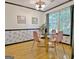 Bright dining room with large window and wood floors at 504 Ridgelake Dr, Peachtree City, GA 30269