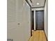 Hallway with closet and dark-trimmed doors at 504 Ridgelake Dr, Peachtree City, GA 30269