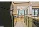 Modern kitchen boasts stainless steel appliances and seamlessly connects to a bright, airy dining area at 504 Ridgelake Dr, Peachtree City, GA 30269