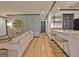 Spacious living room featuring a stylish wet bar, open layout and decorative wallpaper at 504 Ridgelake Dr, Peachtree City, GA 30269