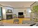 Cozy living room with hardwood floors, a fireplace, and stylish decor at 504 Ridgelake Dr, Peachtree City, GA 30269