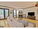Living room featuring hardwood floors, a fireplace, and access to the patio at 504 Ridgelake Dr, Peachtree City, GA 30269