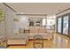 Living room with hardwood floors, stylish furnishings, and an open doorway to the kitchen at 504 Ridgelake Dr, Peachtree City, GA 30269