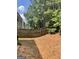 Backyard featuring a wooden fence and mature trees at 645 Stadler Pointe, Mcdonough, GA 30253