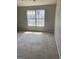 Spacious bedroom with plush carpeting and a large window offering outdoor views at 645 Stadler Pointe, Mcdonough, GA 30253