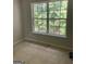 Cozy bedroom with neutral paint and carpet, and a large window for natural light at 645 Stadler Pointe, Mcdonough, GA 30253