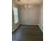 Dining room featuring gray paint, laminate flooring, and a chandelier at 645 Stadler Pointe, Mcdonough, GA 30253