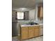 Kitchen with laminate counters, breakfast bar, oak cabinets, and view into the living room at 645 Stadler Pointe, Mcdonough, GA 30253