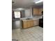 Kitchen with laminate counters, breakfast bar, oak cabinets, and a view to the living room at 645 Stadler Pointe, Mcdonough, GA 30253